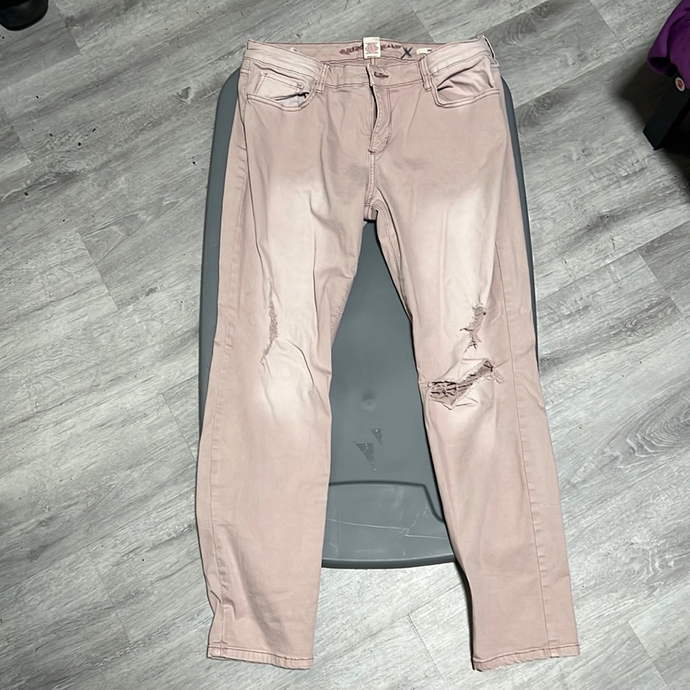 Dusty pink distressed jeans. 13